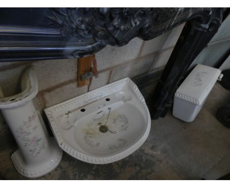 A Salisbury foliate pattern ceramic basin, pedestal and toilet cistern. 