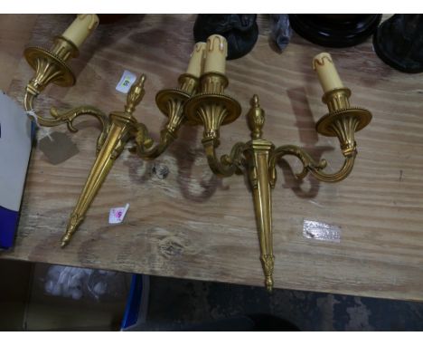 A pair of Regency style ormolu two branch wall light fittings, early 20th CenturyEach with an urn shaped finial above scrolli