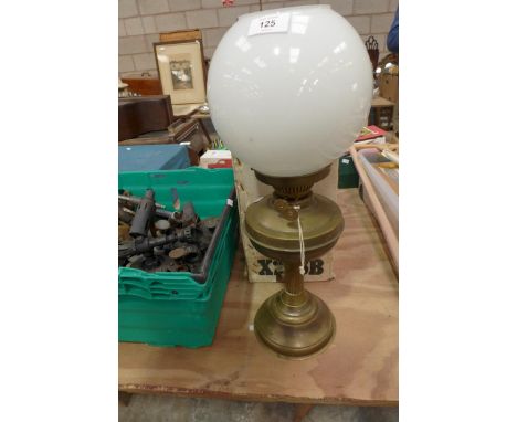 A Victorian brass oil lampWith opaque glass shade and a boxed Tilley lamp. 
