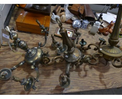 Three various brass ceiling light fittings. 