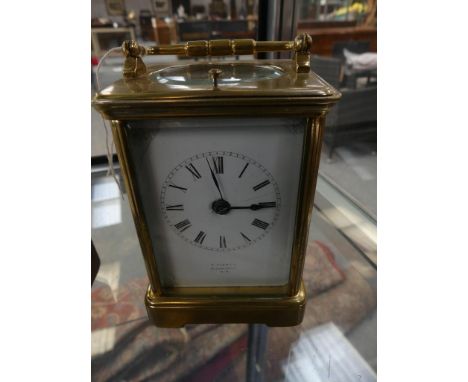 An early 20th century brass cased repeating carriage clock by F Flower, London. 