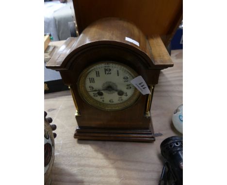 An Edwardian inlaid mahogany mantel clockWith two train movement and white enamel dial. 