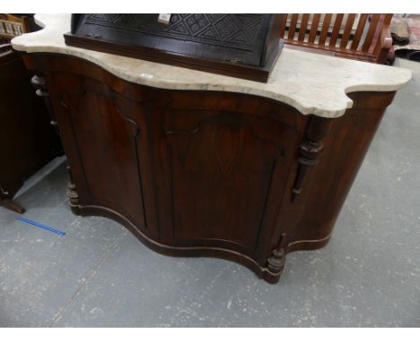 A 19th Century marble top serpentine rosewood credenza sideboardThe shaped marble top above a pair of serpentine doors flanke