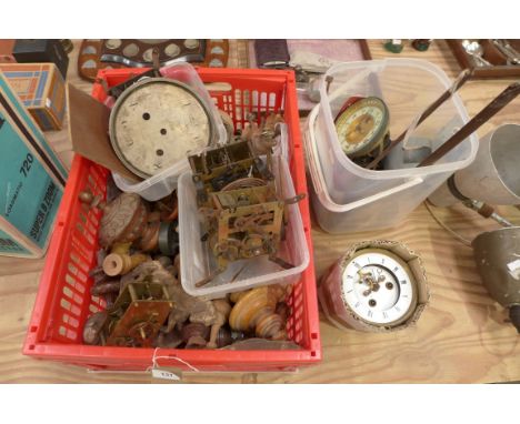 A collection of clock parts and movementsTo include a drum clock movement with enamel dial along with a large collection of t