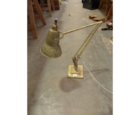 An early 20th century desktop angle poise lamp. 