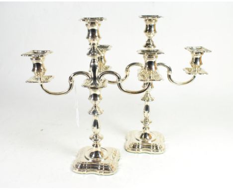 A pair of silver three light candelabra of 18th century style, C J Vander, Sheffield 1999, with shaped square base, knopped s