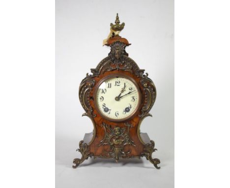 A walnut metal mounted striking mantel clock, movement stamped ''1 million, Lenzkirch''