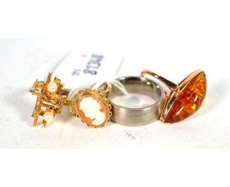 A 9 carat gold abstract cultured pearl ring, finger size K; a 14 carat gold amber ring, finger size L; a 9 carat gold cameo r