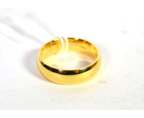 An 18 carat gold band ring, finger size T.  Gross weight 10.47 grams 