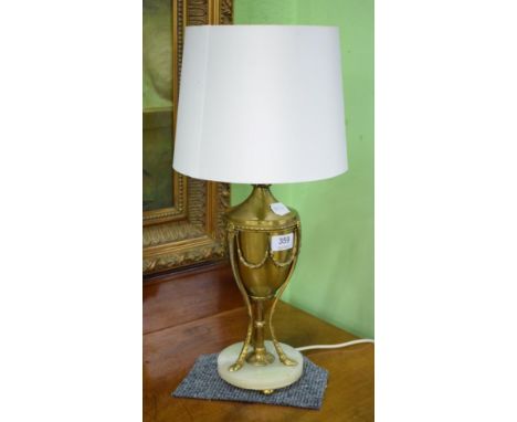 A gilt metal and onyx table lamp