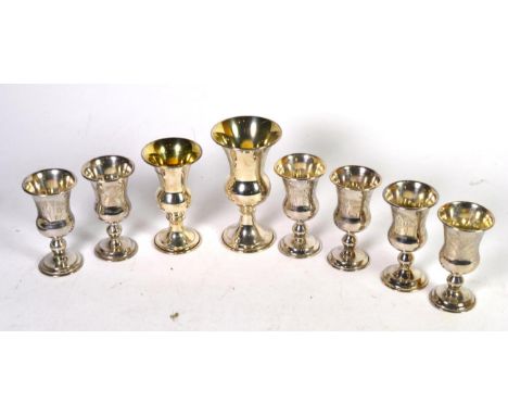 A set of six late Victorian Continental silver Kiddish cups, English import marks for Solomon Ovchinsky, London 1897; togethe