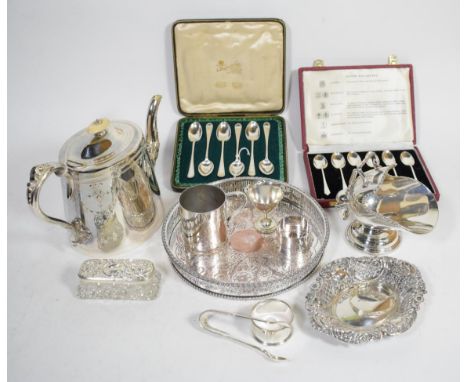 A group of silver items comprising: two sets of coffee spoons, in fitted cases; a pierced dish; dressing table box and a bang