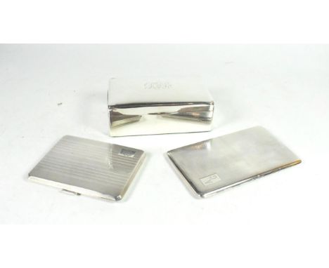 A silver table cigarette box, A &amp; J Zimmerman, Birmingham 1913; and two engine turned silver cigarette cases, the box 13.