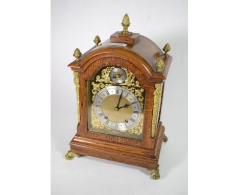 An oak quarter striking mantel clock 