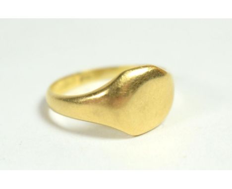 A gents 18 carat gold signet ring, finger size W1/2.  Gross weight - 7.94 grams 