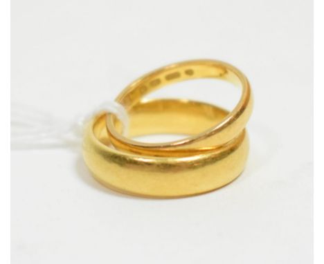 Two 22 carat gold band rings, finger size K and N1/2 (2).  Gross weight - 9.8g gross
