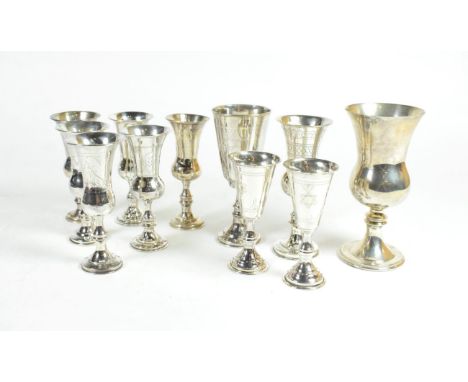 A group of eleven various silver Kiddish cups, various dates and makers, the largest 12.5cm high, 12.7ozt (11) 