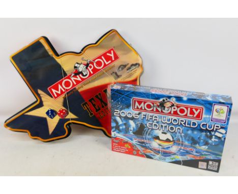 Hasbro - Two Monopoly games comprising Texas Edition (appears unused) and 2006 FIFA World Cup Edition (factory sealed). [2]. 