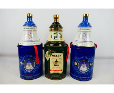 Three Bells Old Scotch Whisky decanters contained in cylindrical presentation containers, all 75cl and 43% abv, two Queen Mot