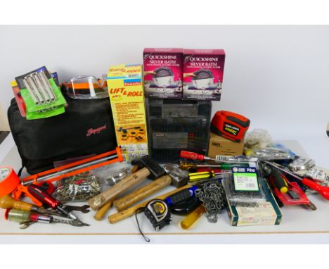 A mixed box of various tools and household items.