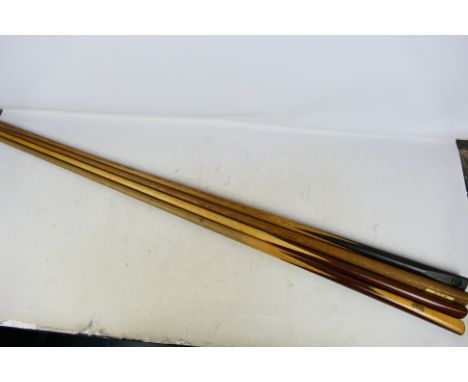 Four vintage snooker cues, largest approximately 147 cm (l). [W]

