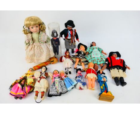 Unknown Maker - 15 x vintage dolls, some in national costume, a Policeman, and an interesting wooden peg type doll. They appe