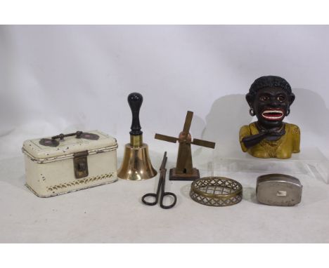 Collectables to consist of a 'Dinha' cast iron money bank. A G.H.L' Hirondelle 'Deposee' metal box. A Brass windmill and bell