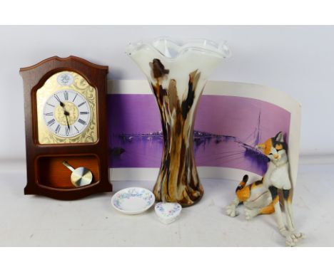 A Tempus Fugit Wall Clock (36cm x 20cm). A glass vase (39cm high), a cat ornament (some damage).Angela Wedgwood China trinket