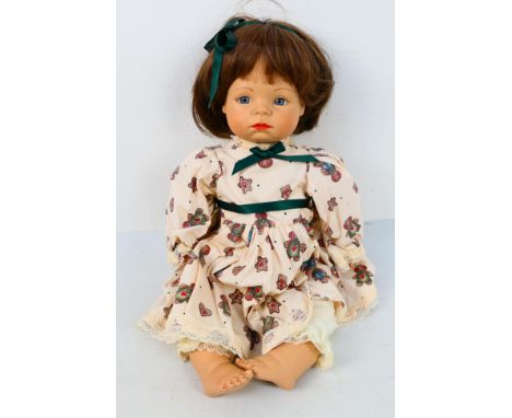 Bebe - Theo R Menzenbach. A loose, vintage Porcelain Doll by Theo R Menzenbach dated 1998 and wearing a dress featuring Ginge