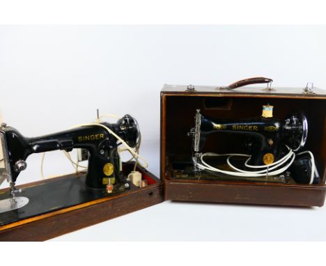 Two vintage Singer sewing machines contained in carry cases. [2]. [W]