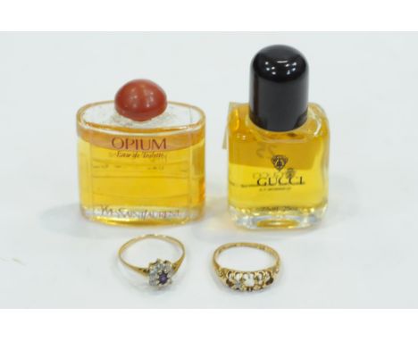 Two miniature perfume sample bottles, Opium by Yves Saint Laurent and Gucci, 18 ct gold ring, weight 2.2 grams, and 9 ct gold