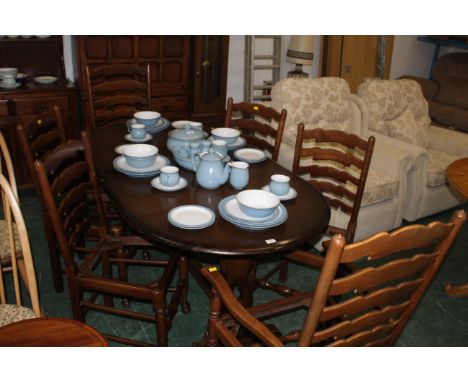 Oak dining table with six ladder back chairs 