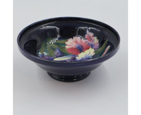 Moorcroft footed bowl in the Orchid pattern, on a cobalt blue ground, 16.5cm D. UK P&amp;P Group 1 (£16+VAT for the first lot