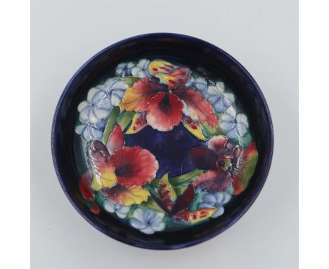 Moorcroft bowl in the Orchid pattern, on a cobalt blue ground, 22cm D. UK P&amp;P Group 2 (£20+VAT for the first lot and £4+V