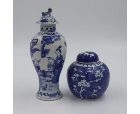 Chinese covered vase, painted in blue with figures watching a rabbit in a garden, four-character Kangxi mark to the base, ove