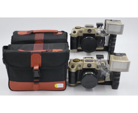 Two Olympia Deluxe 35mm film cameras with flash units and carry cases. UK P&amp;P Group 2 (£20+VAT for the first lot and £4+V