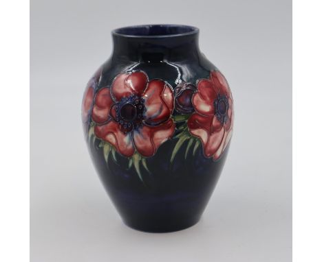 Moorcroft vase in the Anemone pattern on a cobalt blue ground, original paper label to base, 18cm H. UK P&amp;P Group 1 (£16+