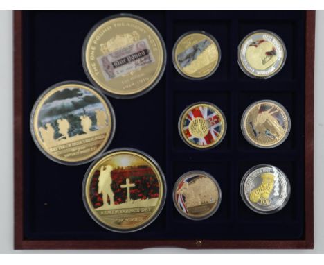 Three large and six small gold plated military medallions in a wooden case. UK P&amp;P Group 1 (£16+VAT for the first lot and