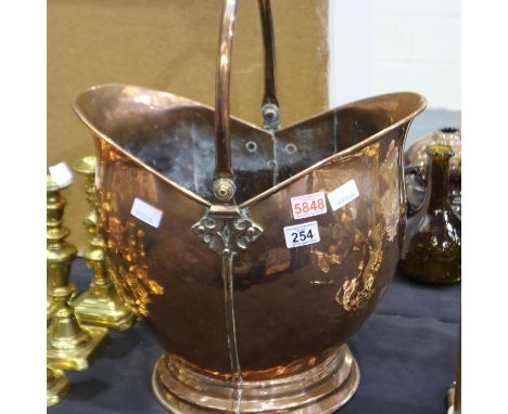 An oversized 19th century copper helmet-form coal bucket with hinged handle, H: 40 cm (exc. handle). Not available for in-hou