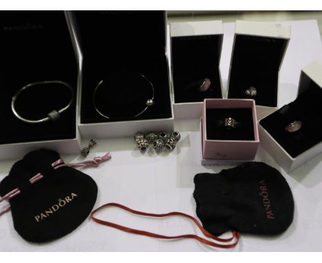 Selection of Pandora silver jewellery including two boxed bracelets, boxed charms and charms in pouches (12 charms total). UK