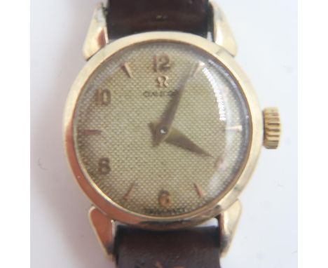 OMEGA: ladies gold plated wristwatch on brown leather strap. UK P&amp;P Group 1 (£16+VAT for the first lot and £2+VAT for sub