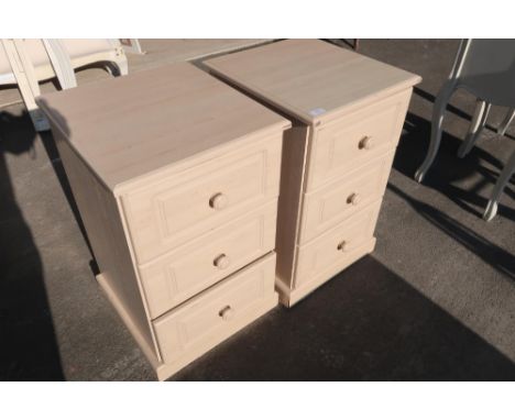 Pair of light wood three drawer bedside chests 