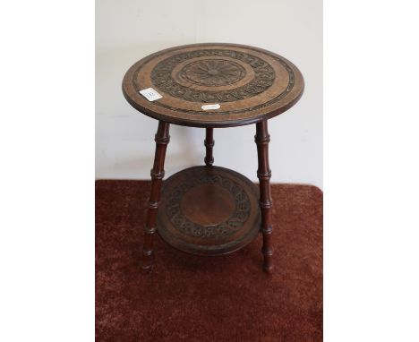 Early 20th C carved mahogany two tier circular occasional table on three faux bamboo supports 