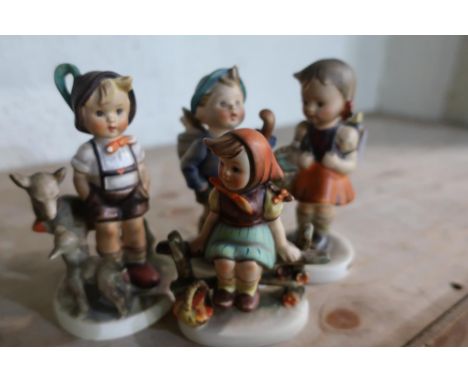 Group of four Goebel (Hummel) figures 