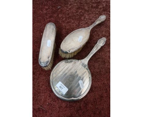 Three piece silver dressing table set 