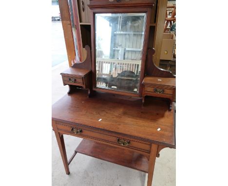 Edwardian walnut dressing table with raised mirror back with two short drawers, above single drawer and under tier on square 