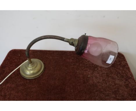 Edwardian brass adjustable neck desk lamp with cranberry glass shade 
