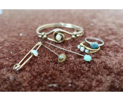 Three stone opal gold ring stamped 375, stock pin set with opal, small stickpin set with turquoise, silver ring set with an o