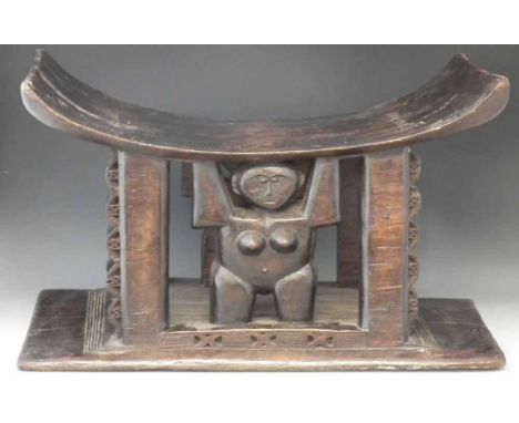 Large Ashanti stool, supported by a female figure, 65cm wide       All lots in this Tribal and African Art Sale are sold subj