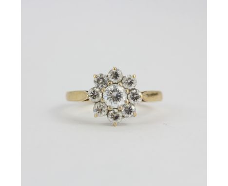 A 14ct yellow gold (stamped 14K) white stone set cluster ring, (M).